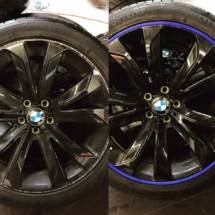 Before And After Installation Image Of Blue AlloyGator Wheel Protector Been Used To Hide Significant Damage To Black BMW Alloy Wheels.
