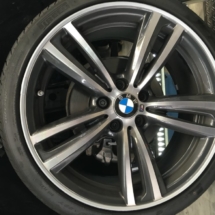 Close Up Silver BMW Alloy Wheel With Silver AlloyGator Wheel Protector