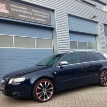 Side View Of Blue Audi With Silver Alloy Wheels And Red AlloyGator Wheel Protection