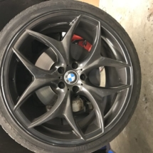 Close Up Of Black AlloyGator Wheel Protector On Black BMW Alloy Wheel