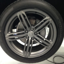 Close Up View Of A Grey Audi Alloy Wheel With Black AlloyGator Wheel Protection