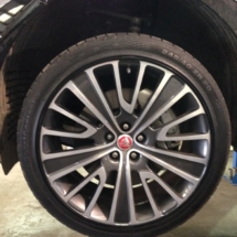 Close Up Of Jaguar Silver & Black Alloy Wheel With Black AlloyGator Wheel Protection