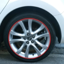 Close Up Of Mazda With Silver Alloy Wheels And Red AlloyGator Wheel Protection
