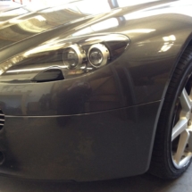 Front View Of Silver Aston Martin With Silver Alloy Wheels And Black AlloyGator Wheel Protection