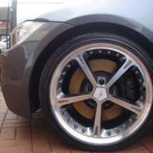 Close Up Of A BMW With Custom Silver Alloy Wheels And Black AlloyGator Wheel Protector