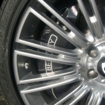 Close Up Of Silver Bentley Alloy Wheel With Black AlloyGator Wheel Rim Protector