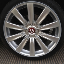 Close Up Of Silver Bentley Alloy Wheel With Silver AlloyGator Wheel Rim Protector