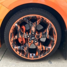 Orange Ford with custom Orange and Black Alloy wheel with Orange AlloyGator alloy wheel rim protectors