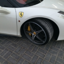 Close Up View Of Front Wheel Of A White Ferrari With Silver Alloy Wheels, Silver AlloyGator Alloy Wheel Protector & Yellow Brake Callipers