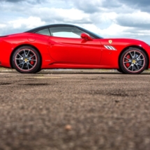 Red Ferrari with alloy wheel rim protectors