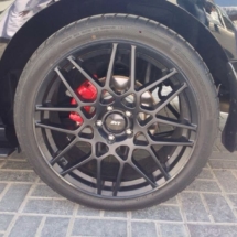 Close Up Of Ford With Black AlloyGator Wheel Rim Protectors And Red Brake Callipers