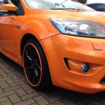Front View Of Orange Ford With Black Alloy Wheels And Orange AlloyGator Wheel Protection