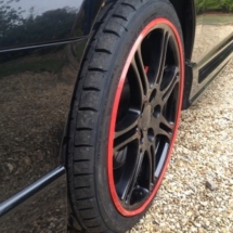 Close Up View Of Honda Civic Type R Black Alloy Wheels With Red AlloyGator Alloy Wheel Protector