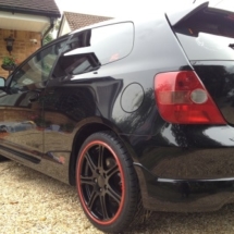 Side View Of Honda Civic Type R Black Alloy Wheels With Red AlloyGator Alloy Wheel Protector