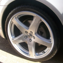 Close Up Of A Silver Jaguar Alloy Wheel With Silver AlloyGator Alloy Wheel Protector