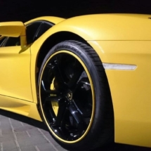 Close Up Of A Yellow Lamborghini With Black Alloy Wheels And Yellow AlloyGator Alloy Wheel Protectors